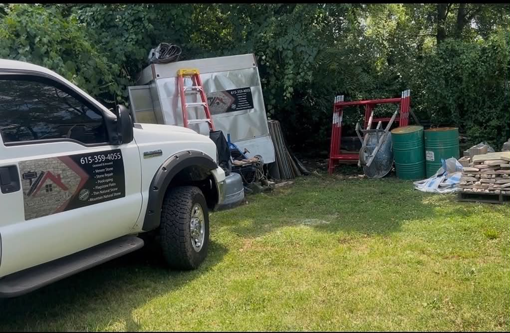 Nunez Masonry branded work truck with services listed on the door
